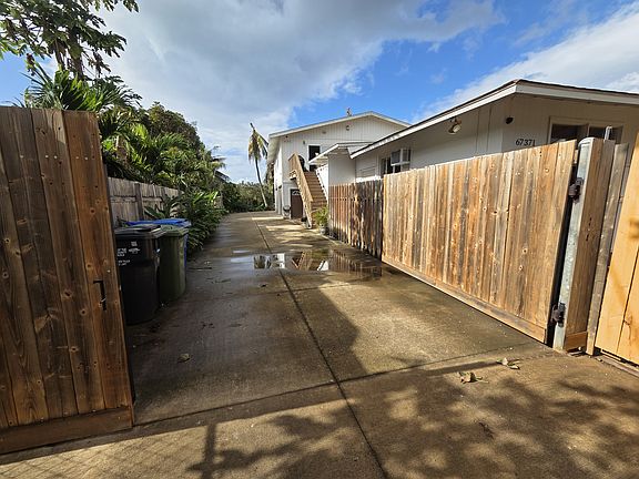 Single lane driveway with front stair access to main 3 bed/2 bath house.