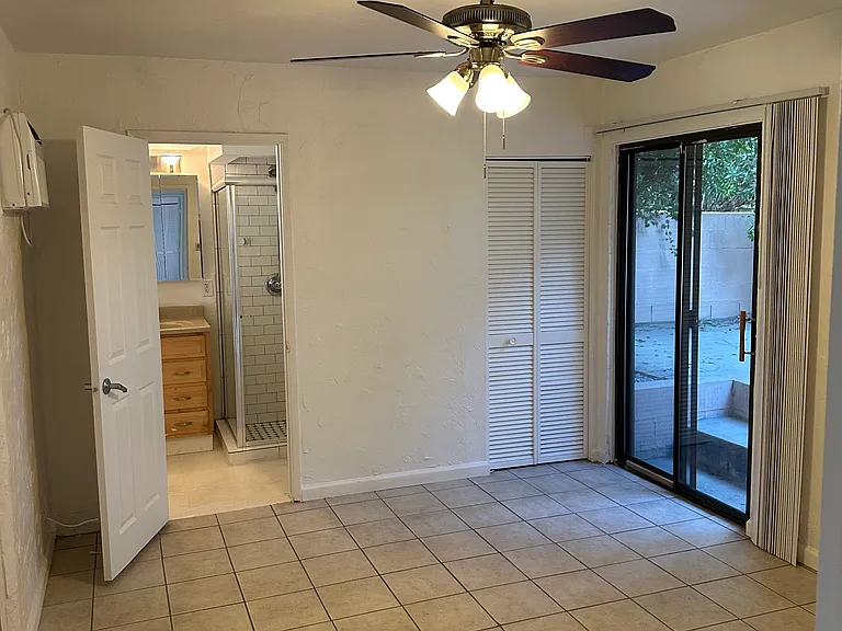 Main bedroom with door to private patio