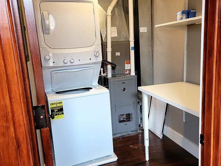 Laundry Room includes updated electrical service and forced air heat/cool. Nice folding table & shelves.