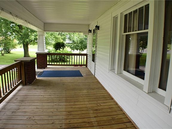 This porch is just waiting for a porch swing or bistro set and a tall glass of ice tea.