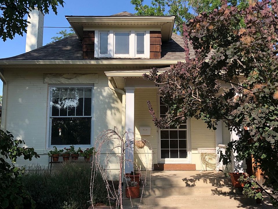 Front entrance with shaded seating on the left facing East with beautiful morning sun.