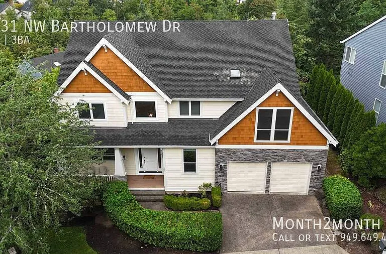 9831 NW Bartholomew Dr — Photo 37