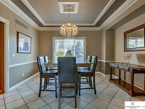 Formal Dining Room with Tile Floors & Beautiful View of the Backyard