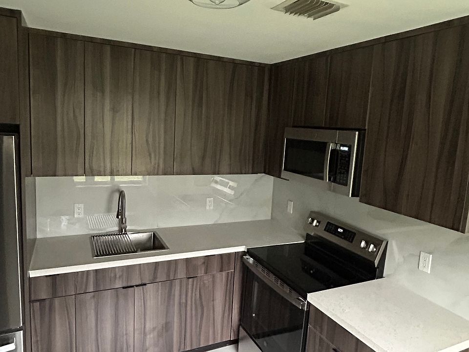 Brand new kitchen (cabinetry, countertops, appliances, and backsplash)