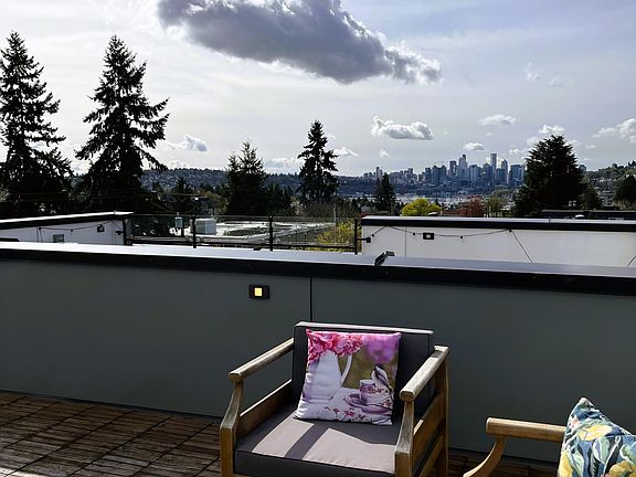 rooftop deck view of lake, Mt.Rainier, city skyline and Space Needle.