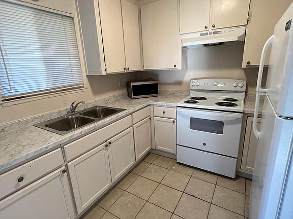 Kitchen. Brand new counters, sinks, faucet, and oven.