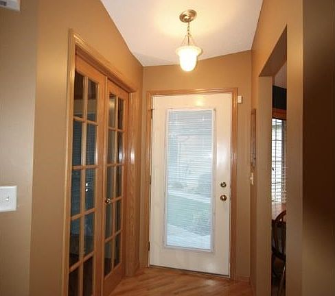 Vauleted Ceiling, hardwood floors and French doors at entry.