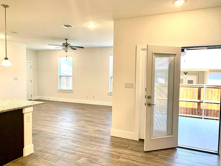 Lots of windows and high ceilings make this a light and bright living space.