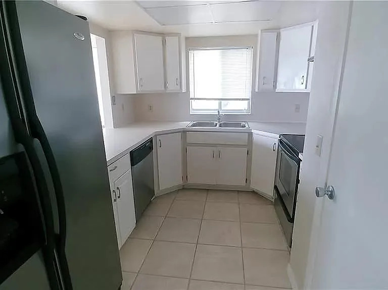 Walking into Kitchen (Door on Right is very large pantry)