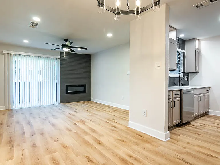Kitchen and living area view of our 2 bed 1 bath apartments! Stainless appliances in select units!