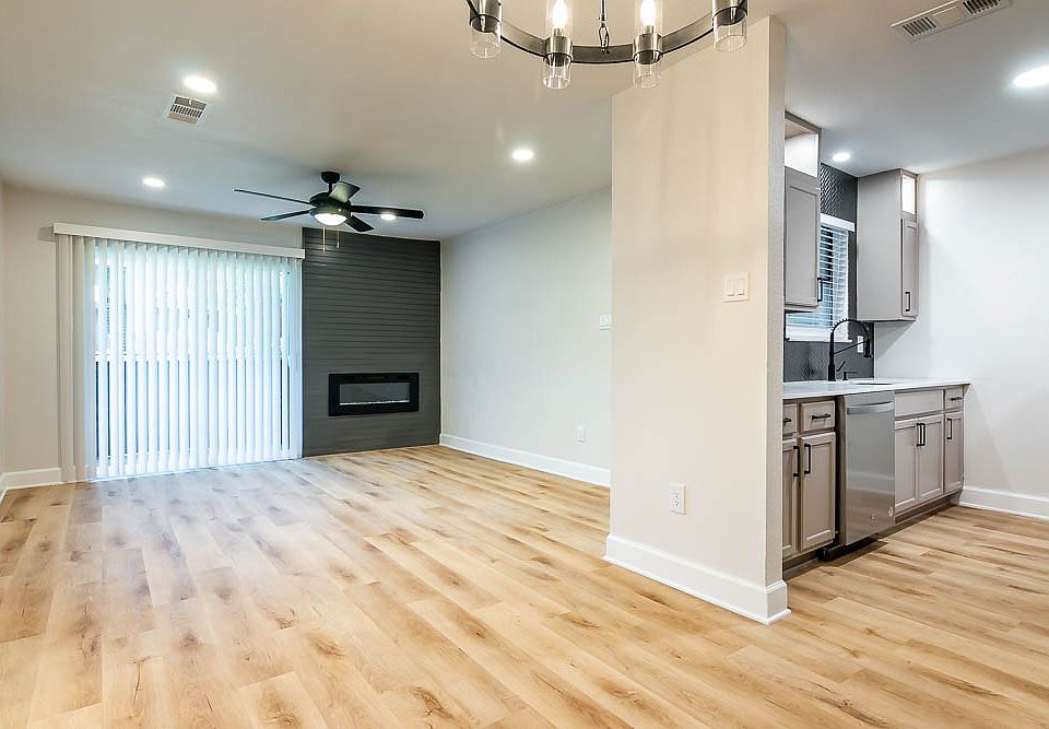 Kitchen and living area view of our 2 bed 1 bath apartments! Stainless appliances in select units!