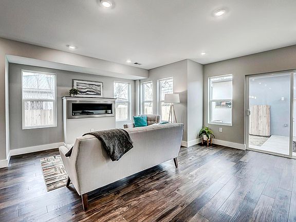 Sliding doors lead to fenced backyard