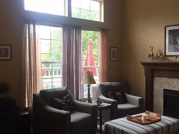 large windows, vaulted ceiling with loft upstairs