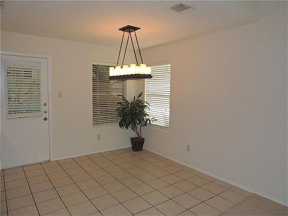 Enjoy this upgraded light fixture which brightens this dining area