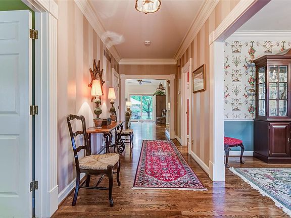 Formal entrance hall opens to dining room, great room, guest bath and master suite