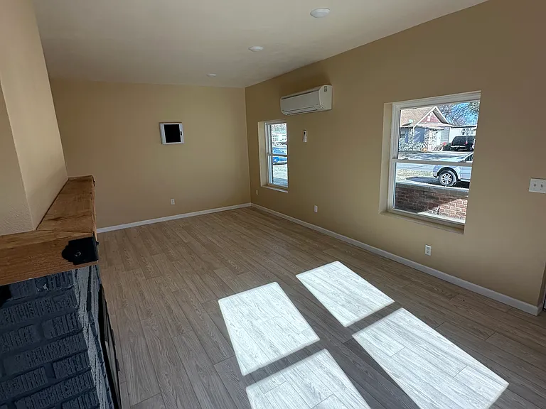 Living room is approximately 13x23 Windows looking out onto your patio. This unit has a locked wifi mechanical box. To the left goes into a hallway to the kitchen.
