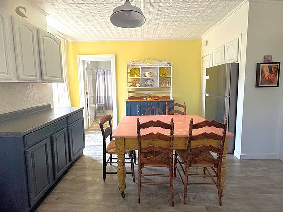 The kitchen/dining area has an adjacent full bathroom.