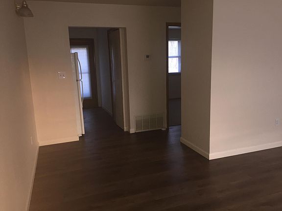 Living room showing kitchen hall to bath and bedroom