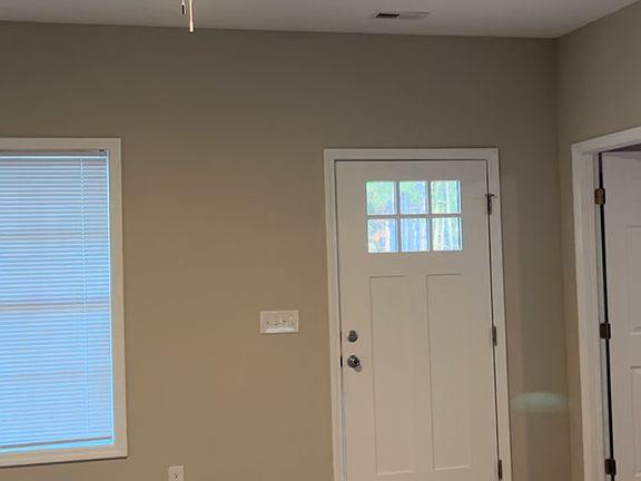 Front door entrance from kitchen .
