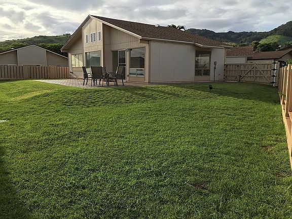 Private backyard with pavers & wrap around walkway.