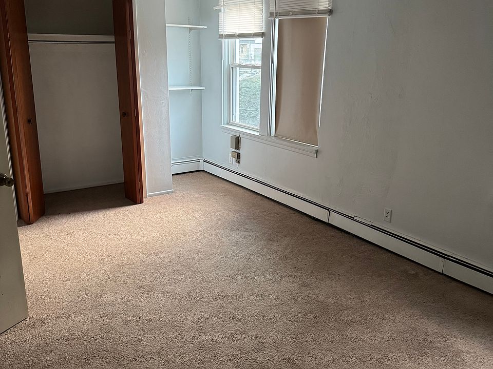 Large Bedroom with plenty of natural light from 4 windows. Deep closet as well as additional shelving.