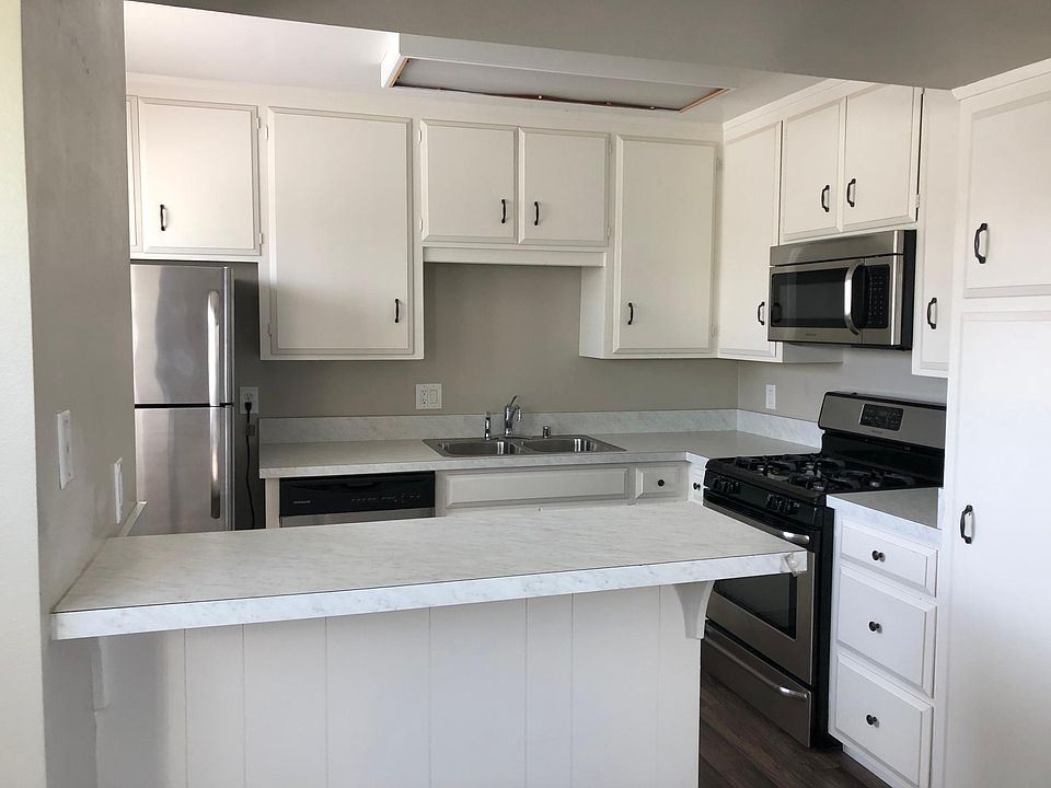 Updated kitchen opens to dining and living rooms.