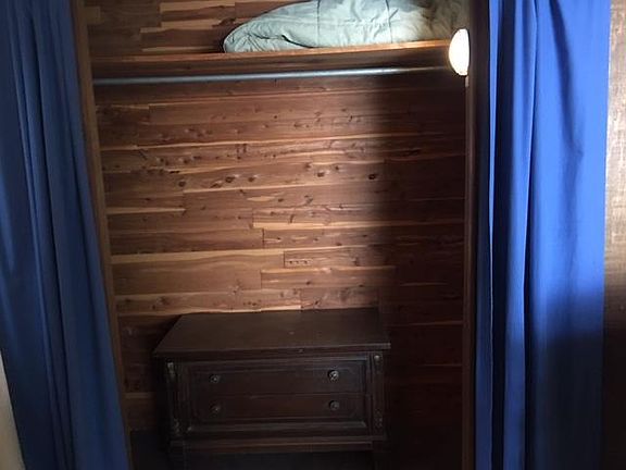 ONE OF TWO LIGHTED CEDAR LINED CLOSETS IN MASTER BEDROOM.