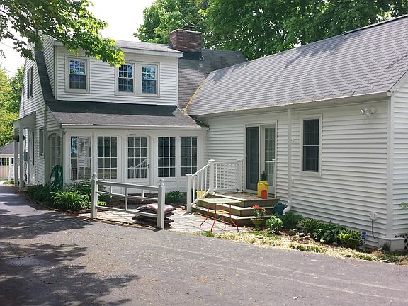 back view - sunroom, deck and private entrance to first flo