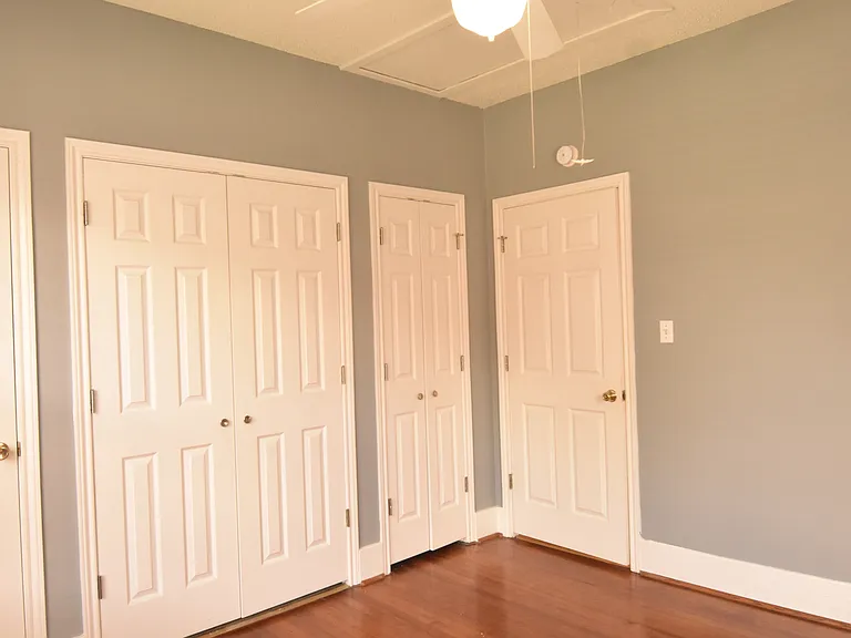 Second bedroom with three storage closets