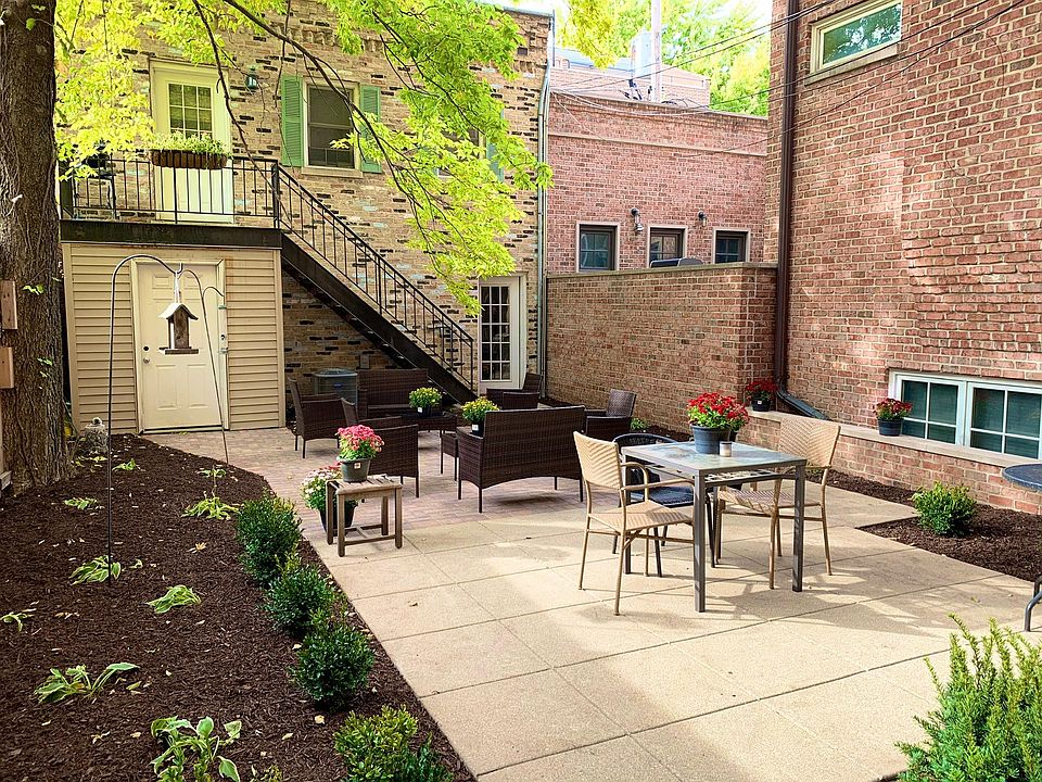 Coach house, rear yard, and patio.