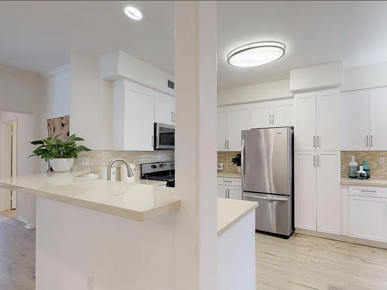 Eat-in kitchen table plus bar w/stools, air fryer, Nespresso machine, ss appliances, quartz counters, and full cookware, etc.