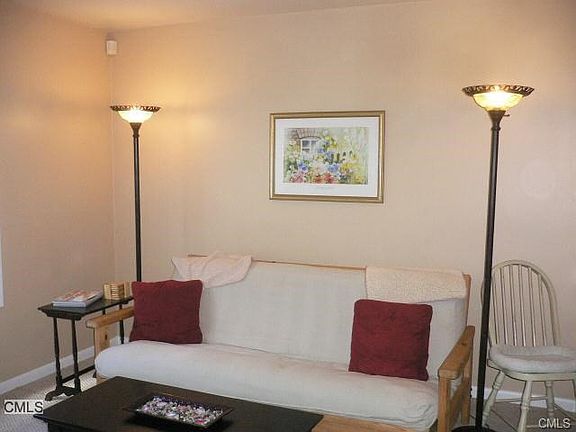 Living room Now has laminate floors entire unit will be freshly painted. Photos from prior owner