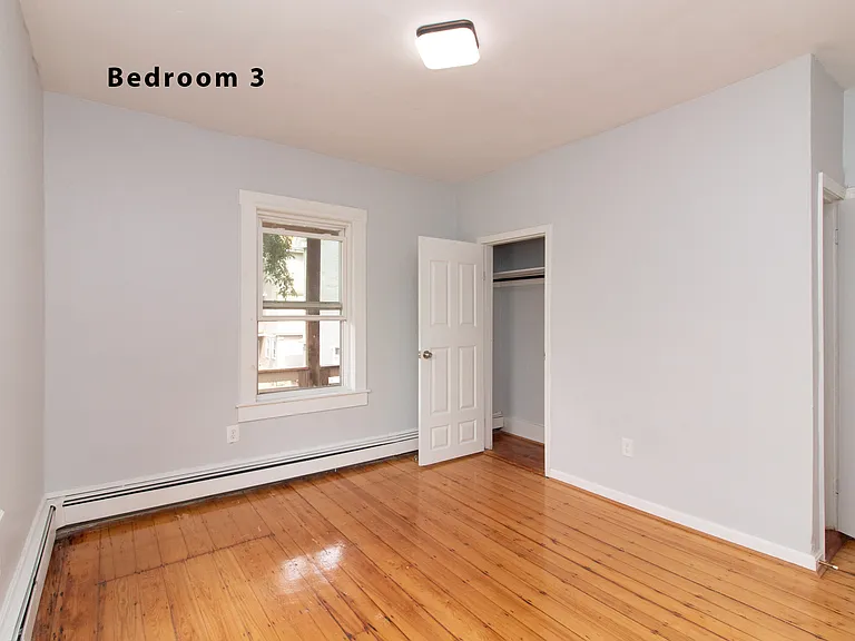 Bedroom 3 is next to kitchen and one window overlooks the porch
