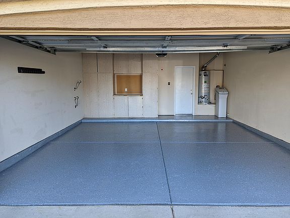Garage with Epoxy flooring, Water softner, Garage cabinets and hooks for bicycle and other equipments