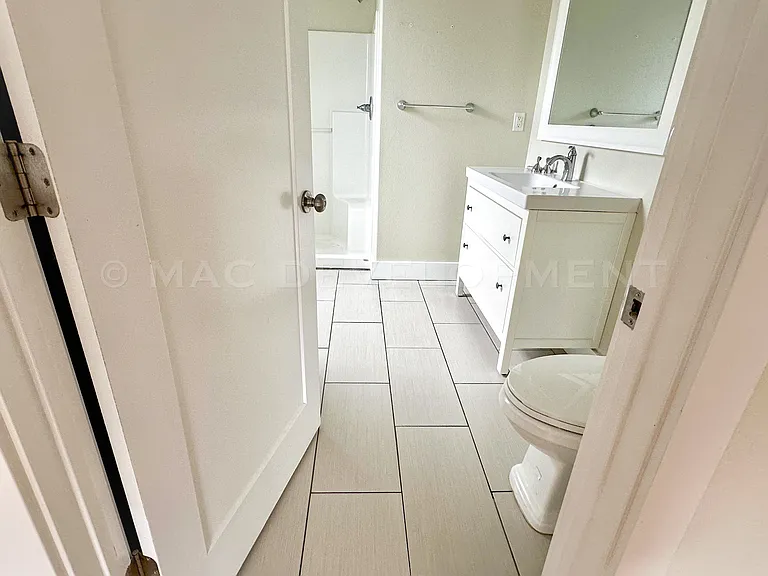 Master Bathroom (Bathroom #3) with Walk-in Shower, Tile Floor, Linen Closet.