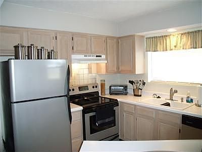 Kitchen newer stainless appliances-fridge,range,dishwasher stay;new faucet