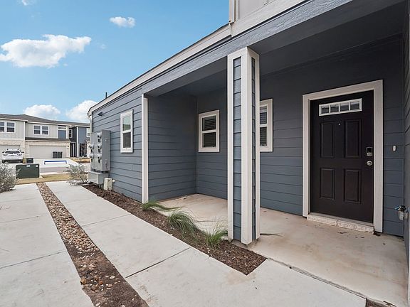 The front door is on the side of the townhome.