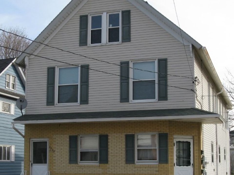 Front of building, apartment is entire first floor.