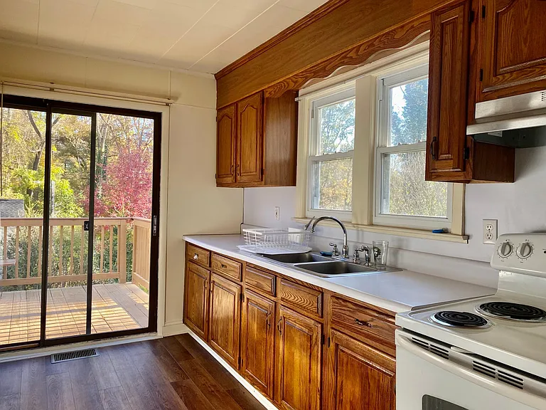Kitchen with sliding door to back deck.
