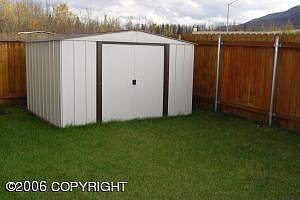 Huge storage shed in the back yard.