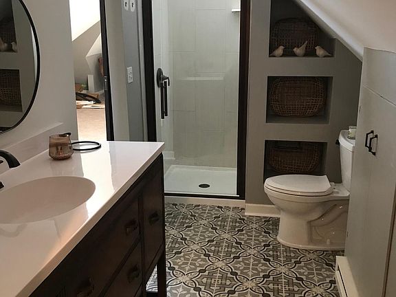 Newly remodeled master bath with all new tile shower, floor, vanity, sink and toilet. Walk in closet is adjacent to bathroom. Great storage.