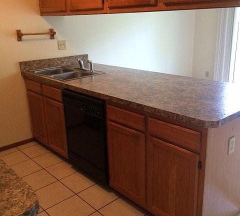 Kitchen-granite look counters/breakfast bar with 6ft prep island.