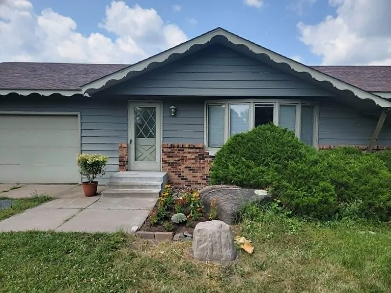 Front entry. Includes 1 car garage and off street parking for 2nd car.