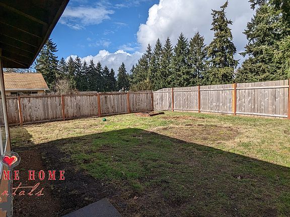 Huge, fully fenced in back yard for kids and pets to play