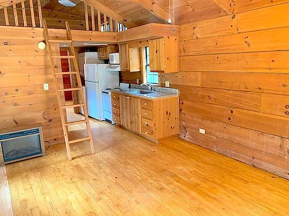 Loft serves as second bedroom or storage area!