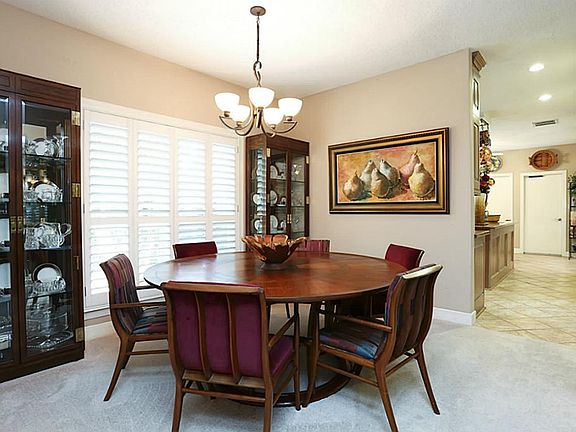 Great entertaining flow. Formal dining room has windows that look out to landscape and tennis courts