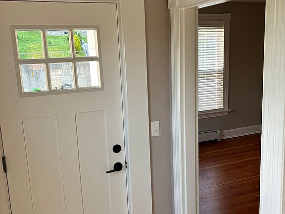 Foyer, view of front door and entrance to living room