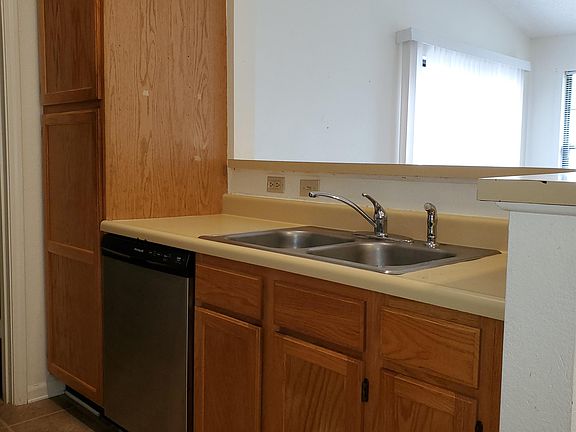 kitchen with half bar opening to the living room