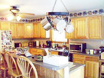 Do you enjoy entertaining and cooking? Here is a warm brightly lite area for hanging out in or cooking from the days fishing or hunting trips.