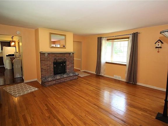 Large 15x15 Living Room w/ Gorgeous Front Bay Window & Big Back Picture Window allowing plenty of Natural Light to Flow through-